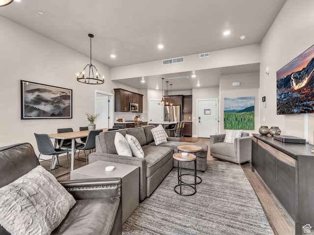 909 W Peace Tree Trl W Unit 416, Heber City, UT 84032 - living area with light wood-type flooring, a chandelier, and recessed lighting