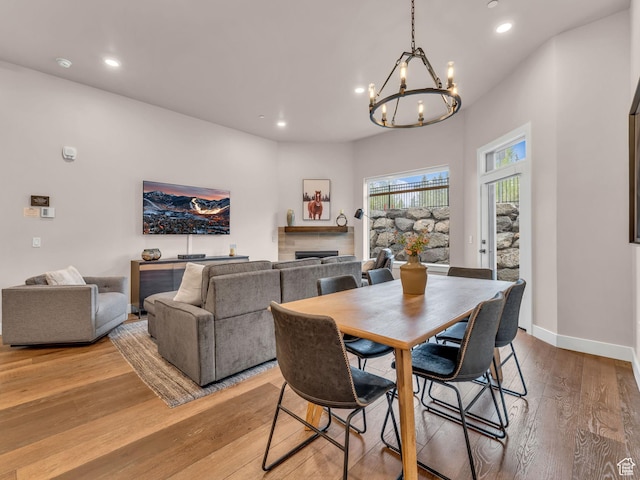909 W Peace Tree Trl W Unit 416, Heber City, UT 84032 - dining space featuring a chandelier, light wood-style floors, recessed lighting, a fireplace, and baseboards