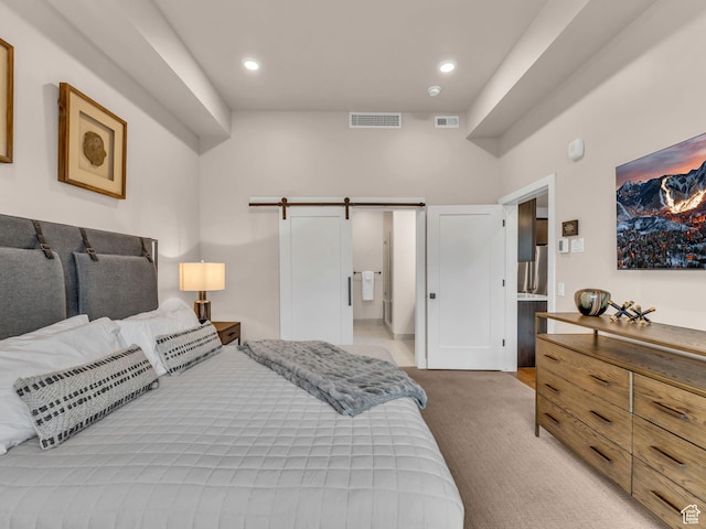 909 W Peace Tree Trl W Unit 416, Heber City, UT 84032 - bedroom featuring light carpet, a barn door, and recessed lighting