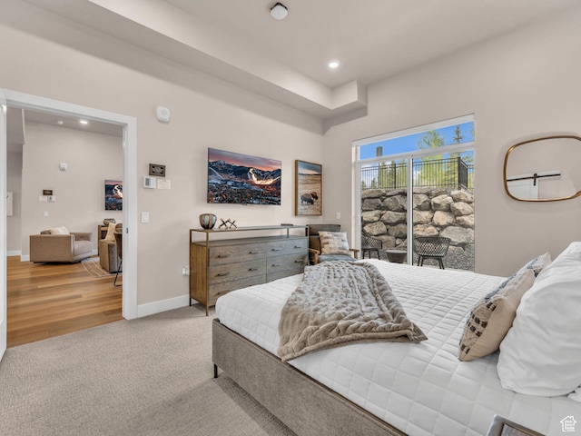 909 W Peace Tree Trl W Unit 416, Heber City, UT 84032 - bedroom with access to outside, recessed lighting, light colored carpet, baseboards, and light wood-style floors