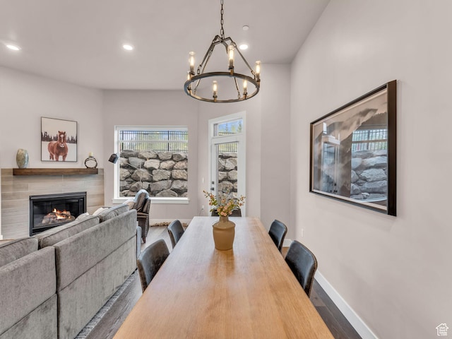 909 W Peace Tree Trl W Unit 416, Heber City, UT 84032 - dining area featuring wood finished floors, a chandelier, a tile fireplace, baseboards, and recessed lighting