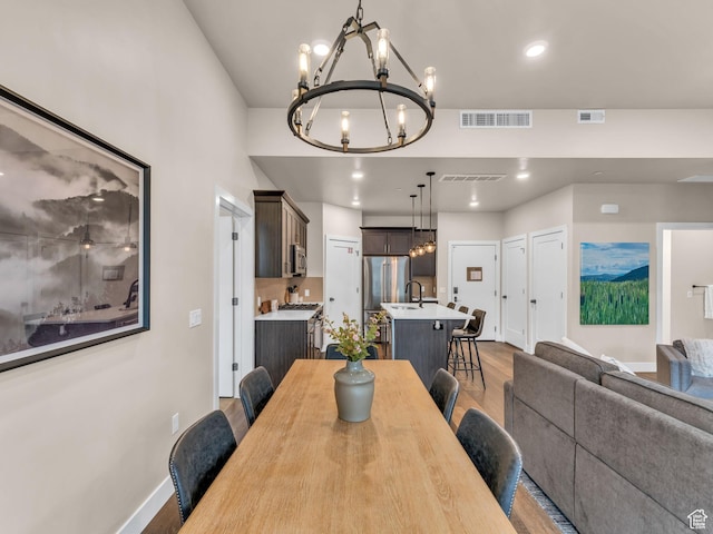 909 W Peace Tree Trl W Unit 416, Heber City, UT 84032 - dining area with a chandelier, light wood-type flooring, baseboards, and recessed lighting