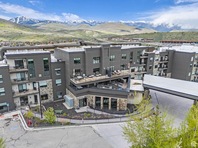 909 W Peace Tree Trl W Unit 416, Heber City, UT 84032 - view of building exterior with a mountain view and fence