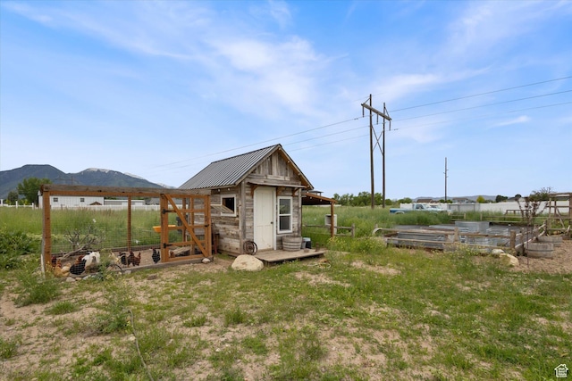 709 W 400 N, Mapleton, UT 84664 - view of yard with a mountain view, an outbuilding, exterior structure, and a vegetable garden