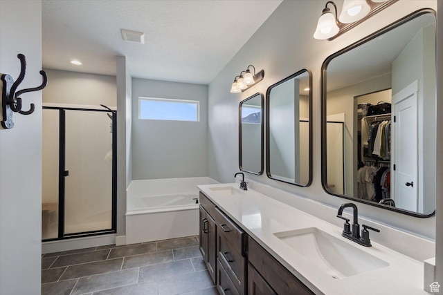 709 W 400 N, Mapleton, UT 84664 - full bath featuring a stall shower, a garden tub, double vanity, a spacious closet, and recessed lighting