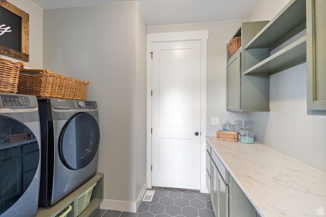 709 W 400 N, Mapleton, UT 84664 - laundry room featuring washing machine and clothes dryer, dark tile patterned floors, cabinet space, and baseboards