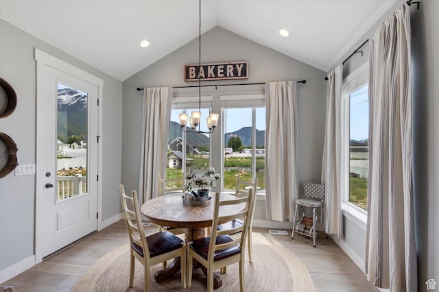 709 W 400 N, Mapleton, UT 84664 - dining area featuring a chandelier, lofted ceiling, plenty of natural light, light wood-style flooring, and recessed lighting