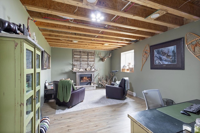 709 W 400 N, Mapleton, UT 84664 - living room with light wood-style flooring, a glass covered fireplace, and a desk