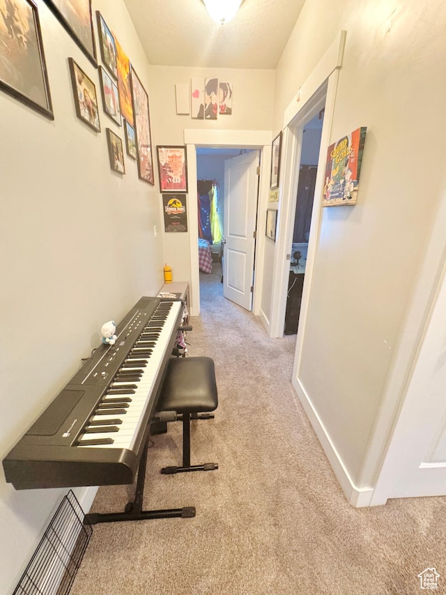 hallway featuring carpet flooring