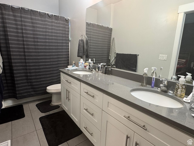 full bathroom featuring tile patterned floors, toilet, double vanity, and a shower with curtain
