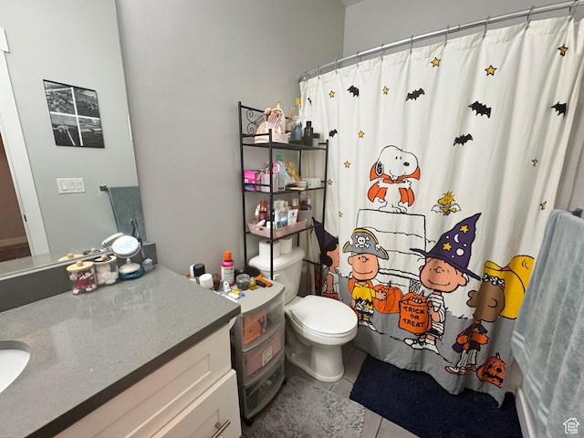 full bath featuring tile patterned flooring, vanity, toilet, and curtained shower