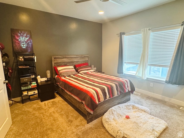 bedroom with carpet flooring, a ceiling fan, and baseboards