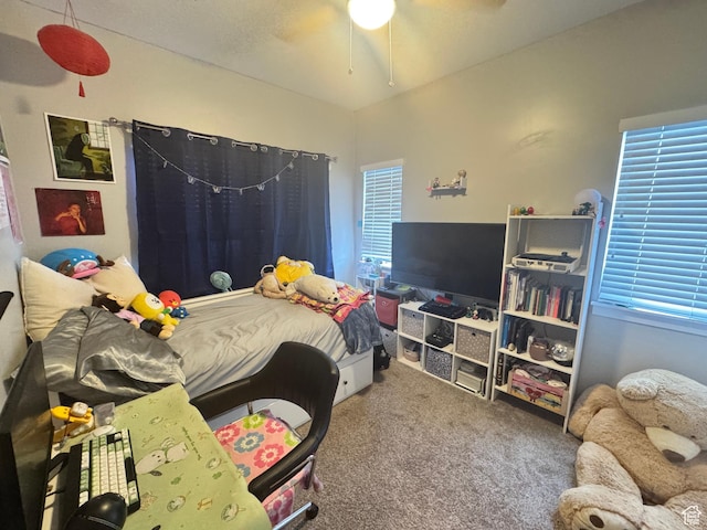 carpeted bedroom with a ceiling fan