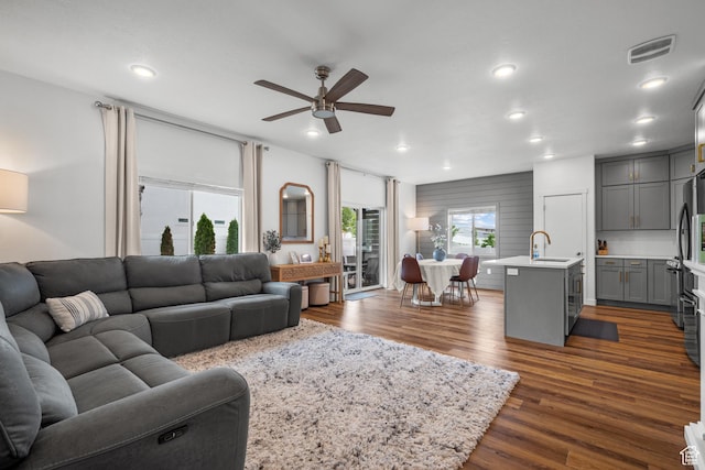 6613 S Ellerston Dr W, Murray, UT 84123 - living room featuring a ceiling fan, dark wood finished floors, and recessed lighting