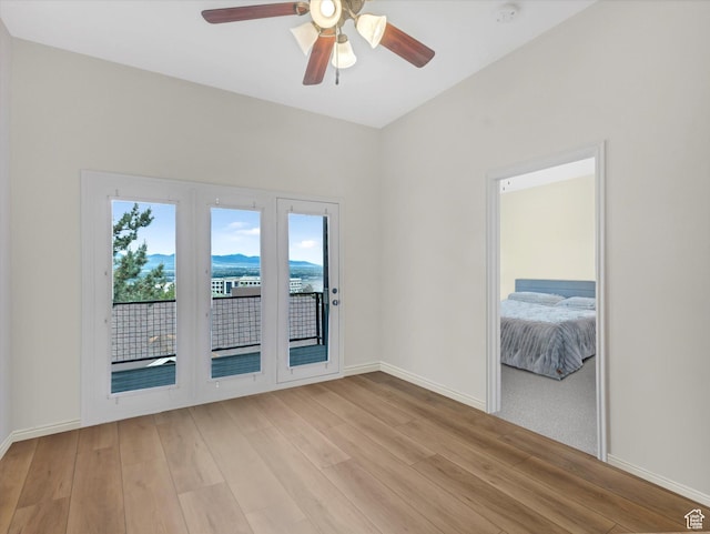 14910 S Ox Cart Ln, Draper, UT 84020 - unfurnished room featuring light wood-style flooring, a ceiling fan, and a smoke detector