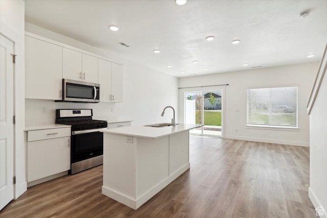 1862 S 1280 W, Logan, UT 84321 - kitchen featuring stainless steel appliances, a sink, light wood-style flooring, light countertops, and white cabinetry