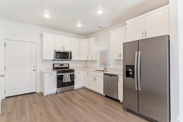 1908 S 1280 W, Logan, UT 84321 - kitchen with stainless steel appliances, a sink, light countertops, white cabinets, and recessed lighting