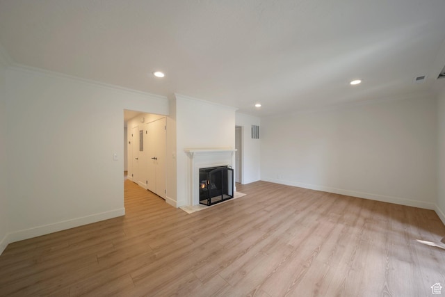 4604 S Woodduck Ln, Millcreek, UT 84117 - unfurnished living room with ornamental molding, recessed lighting, baseboards, light wood-type flooring, and a fireplace with flush hearth
