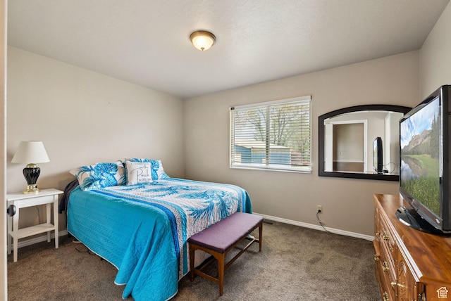 bedroom with carpet floors and baseboards