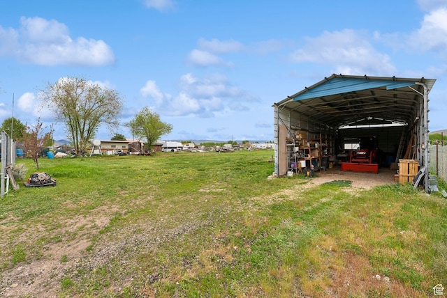 view of grassy yard featuring a detached carport