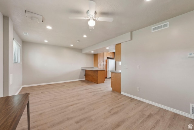 unfurnished living room featuring recessed lighting, light wood-type flooring, baseboards, and ceiling fan