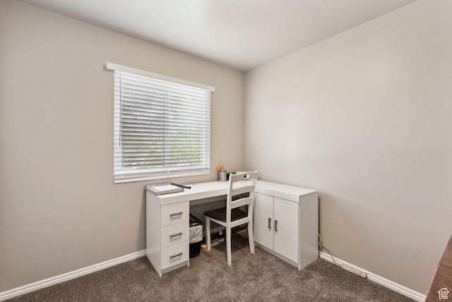 carpeted home office with baseboards