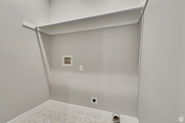 laundry area with hookup for a washing machine, baseboards, hookup for an electric dryer, and tile patterned floors