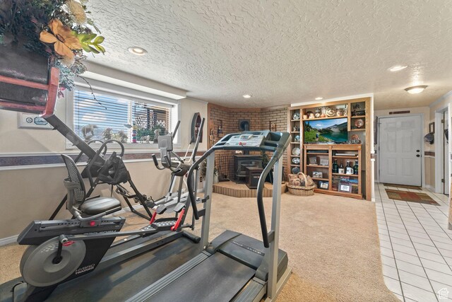 6407 N Dry Fork Cyn W, Dry Fork, UT 84078 - workout area featuring tile patterned floors, a textured ceiling, recessed lighting, baseboards, and carpet