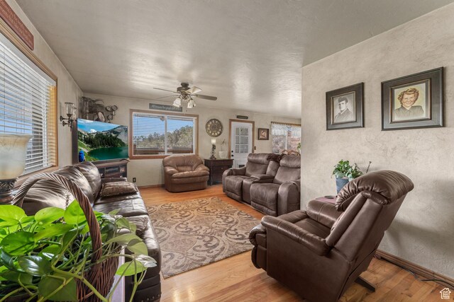 6407 N Dry Fork Cyn W, Dry Fork, UT 84078 - living area with wood finished floors, a ceiling fan, and a textured wall