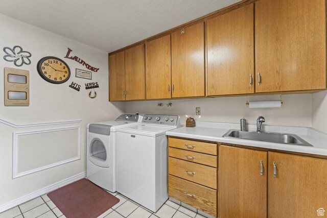 6407 N Dry Fork Cyn W, Dry Fork, UT 84078 - clothes washing area featuring cabinet space, washing machine and clothes dryer, and light tile patterned floors