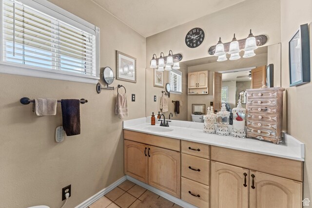 6407 N Dry Fork Cyn W, Dry Fork, UT 84078 - bathroom with tile patterned floors, plenty of natural light, vanity, and baseboards