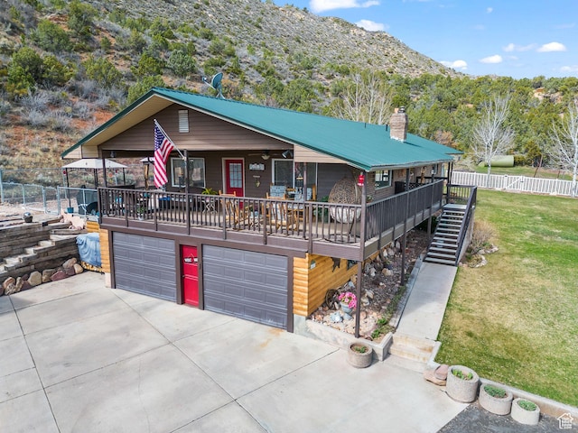 6407 N Dry Fork Cyn W, Dry Fork, UT 84078 - view of front of property featuring an attached garage, driveway, a mountain view, and stairway