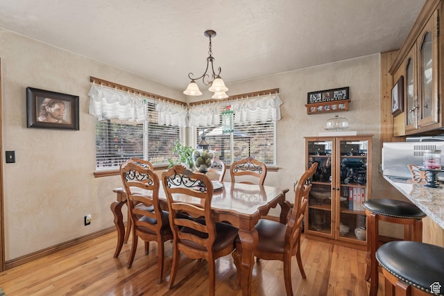 6407 N Dry Fork Cyn W, Dry Fork, UT 84078 - dining room with light wood finished floors, baseboards, and a textured wall