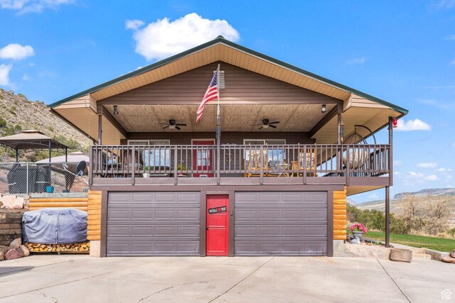 6407 N Dry Fork Cyn W, Dry Fork, UT 84078 - view of front of property featuring ceiling fan, driveway, an attached garage, and a mountain view