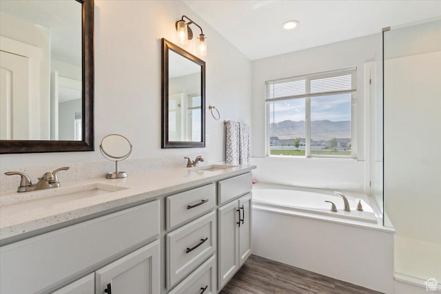 5118 N Blackbrush Dr, Eagle Mountain, UT 84005 - full bath with wood finished floors, double vanity, a bath, and recessed lighting