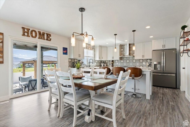 5118 N Blackbrush Dr, Eagle Mountain, UT 84005 - dining space with wood finished floors and recessed lighting