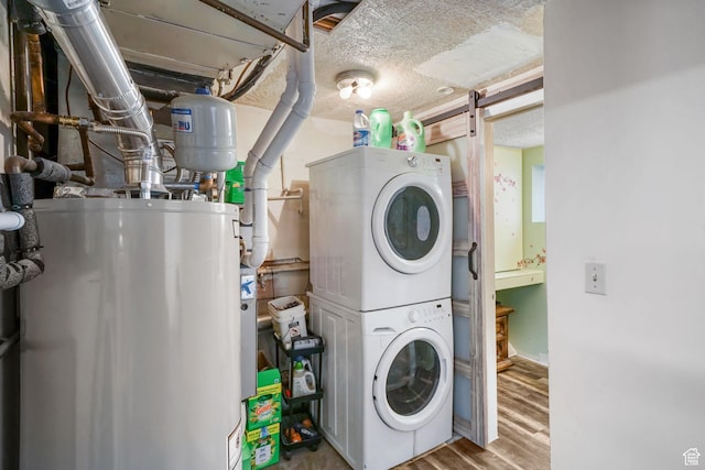 648 S 1350 E, Provo, UT 84606 - washroom with gas water heater, stacked washer / dryer, and wood finished floors