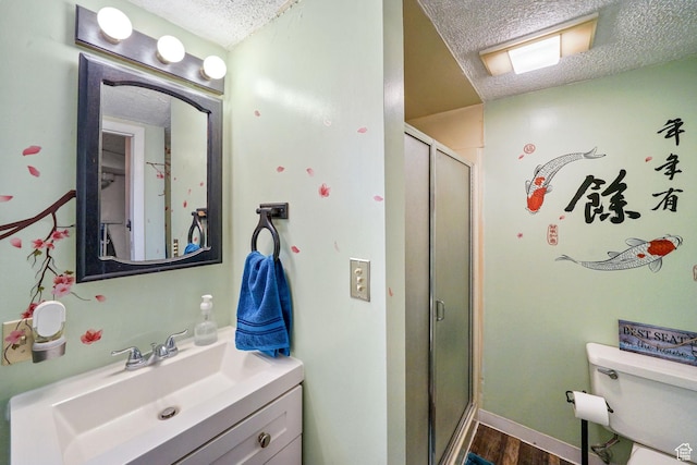 648 S 1350 E, Provo, UT 84606 - full bath with a textured ceiling, vanity, a shower stall, and wood finished floors