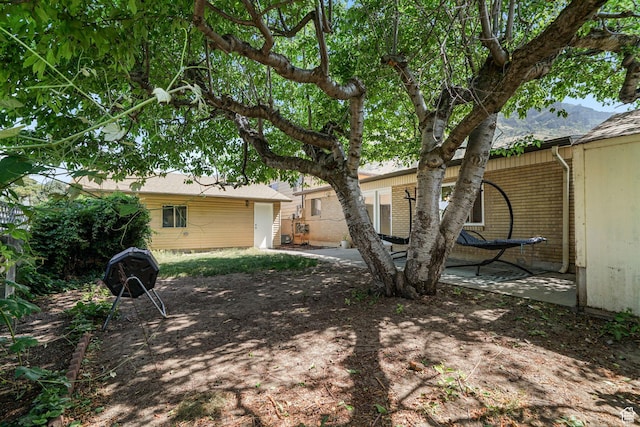648 S 1350 E, Provo, UT 84606 - rear view of property with brick siding, a patio, and a mountain view