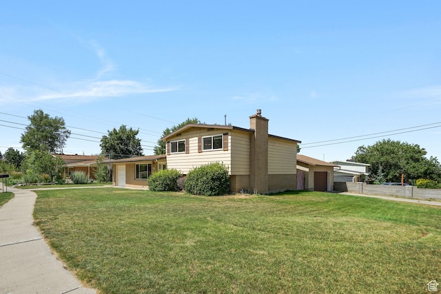648 S 1350 E, Provo, UT 84606 - view of front facade with brick siding, a chimney, and a garage