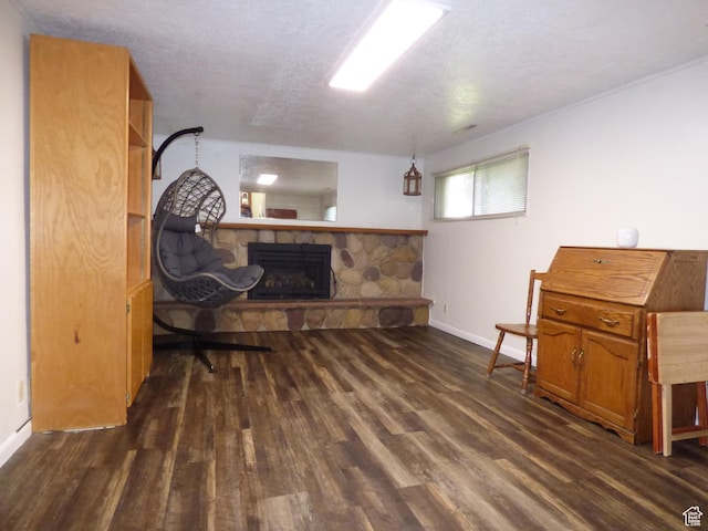 648 S 1350 E, Provo, UT 84606 - sitting room with a stone fireplace, dark wood-type flooring, and baseboards