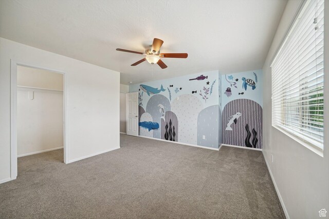 1805 W Grays Pl N, Lehi, UT 84043 - unfurnished bedroom with carpet, baseboards, a ceiling fan, and a spacious closet