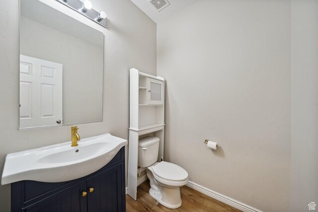 1805 W Grays Pl N, Lehi, UT 84043 - bathroom with wood finished floors, toilet, baseboards, and vanity