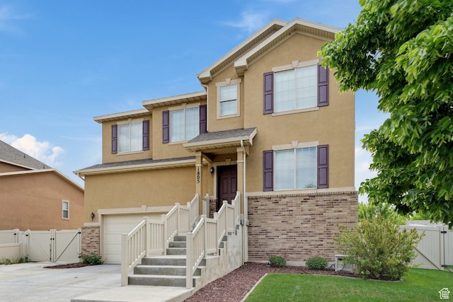 1805 W Grays Pl N, Lehi, UT 84043 - view of front of home with a gate, stucco siding, a garage, concrete driveway, and fence