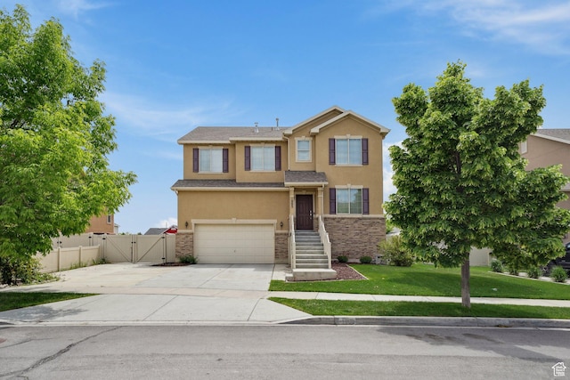1805 W Grays Pl N, Lehi, UT 84043 - traditional home with a gate, stucco siding, an attached garage, stone siding, and concrete driveway