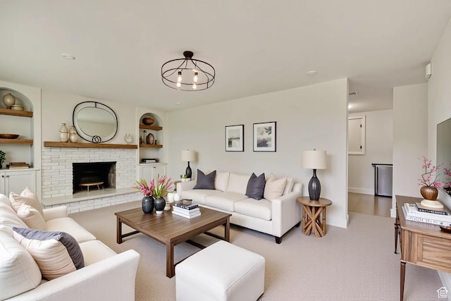 160 E 7060 S, Midvale, UT 84047 - living room featuring a fireplace, carpet, built in shelves, and baseboards