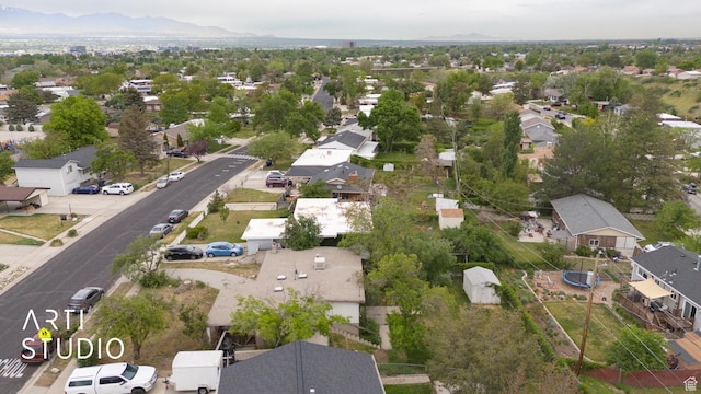 941 E Carnation Dr, Sandy, UT 84094 - aerial view of property and surrounding area featuring nearby suburban area and a mountainous background