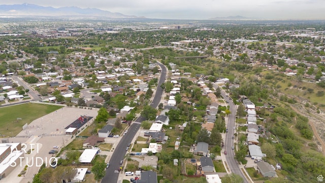 941 E Carnation Dr, Sandy, UT 84094 - aerial view of property's location with a mountain backdrop and nearby suburban area