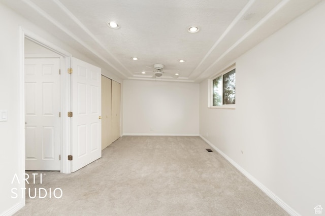 941 E Carnation Dr, Sandy, UT 84094 - unfurnished bedroom with light colored carpet, recessed lighting, baseboards, and a raised ceiling