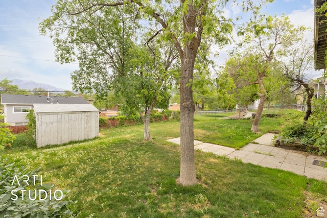 941 E Carnation Dr, Sandy, UT 84094 - view of yard with a storage shed and an outbuilding